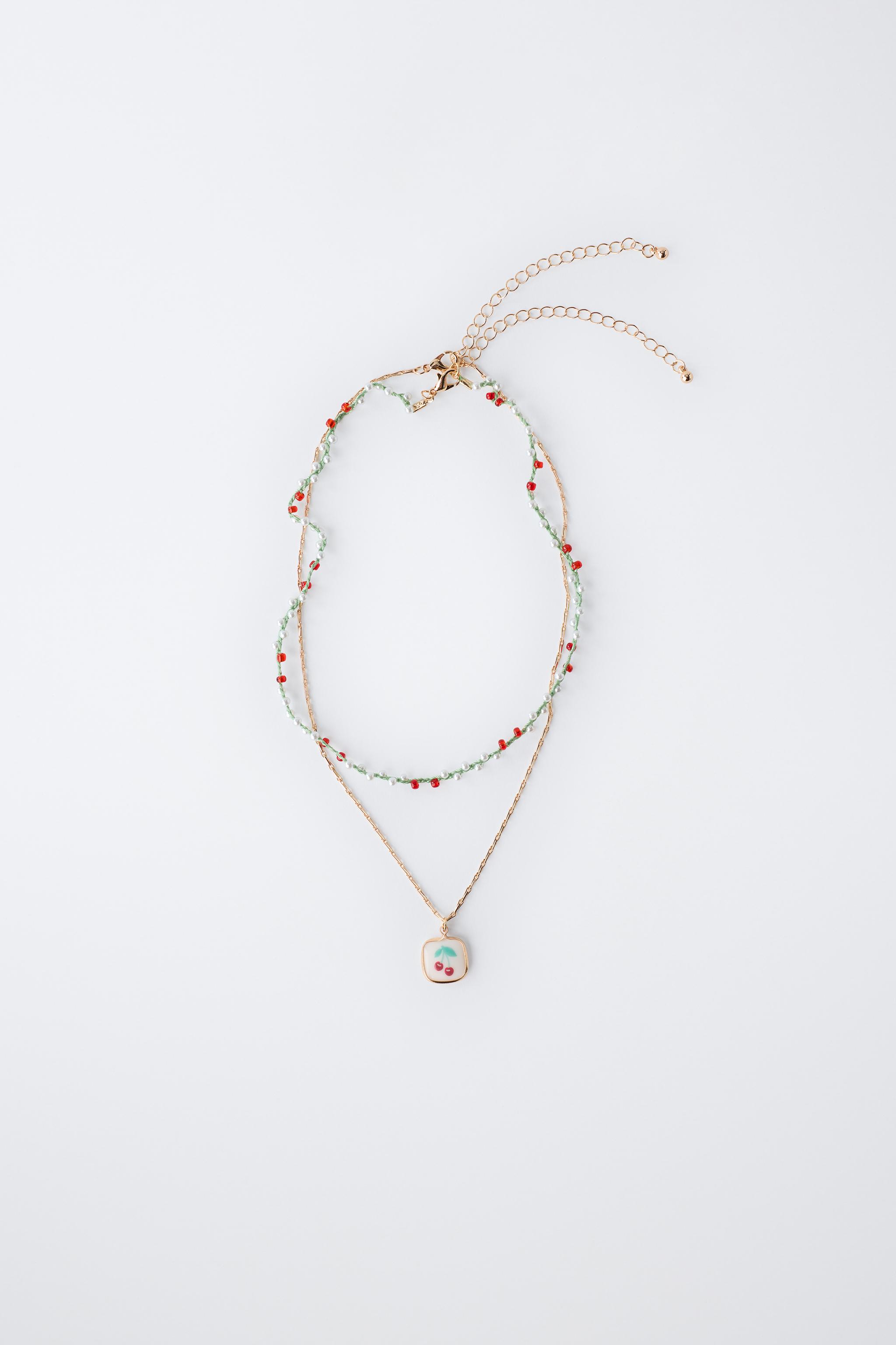 LOT DE DEUX COLLIERS FANTAISIE CEREISES